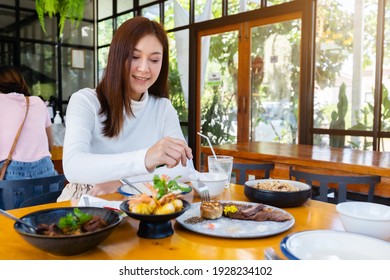 Woman Eating Food In The Restaurant