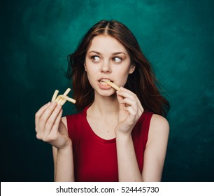 Woman Eating French Fries. Junk Food. Fast Food