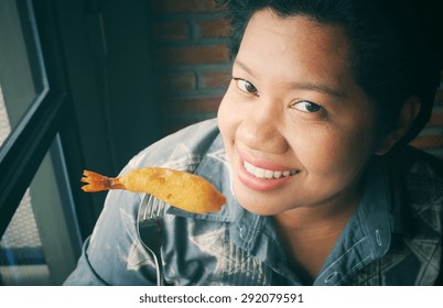 Woman Eating Fried Shrimp