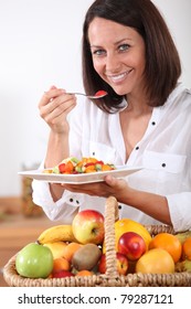 Woman Eating Fruit Salad