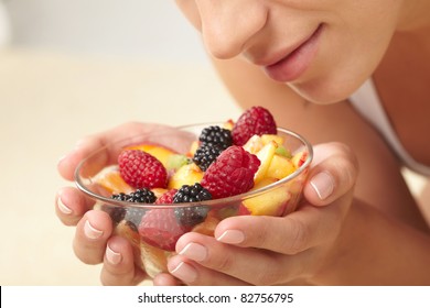 Woman Eating Fruit Salad