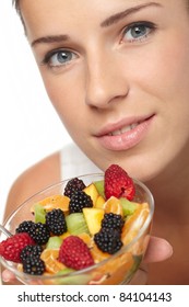 Woman Eating Fruit Salad