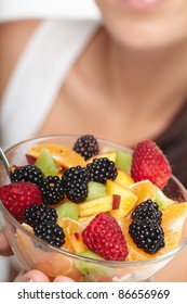 Woman Eating Fruit Salad