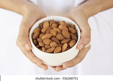 Woman Eating Healthy Of Almonds