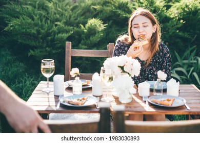 Woman Eating Homemade Pizza In Back Yard. 