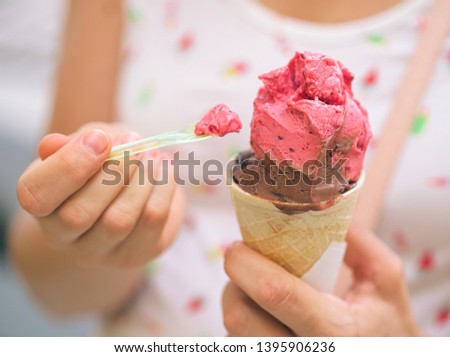 Woman Eating Ice Cream with Plastic Spoon Closeup