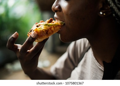 A Woman Eating Pizza