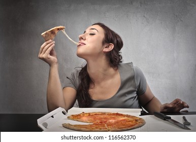 Woman eating a pizza