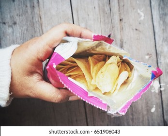 Woman Eating Potato Chip