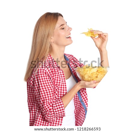 Woman eating potato chips on white background