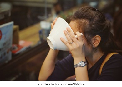 Woman Eating Ramen Noodles At Market ,street Food , Bangkok Thailand