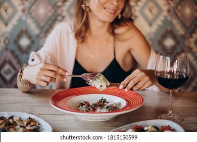 Woman Eating Ravioli In An Italian Restaurant