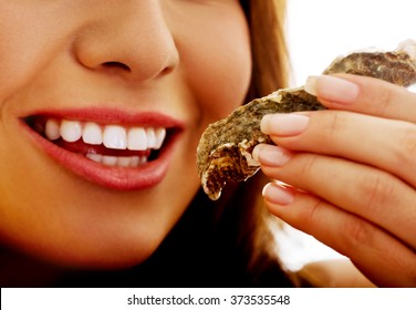 Woman Eating Shellfish.