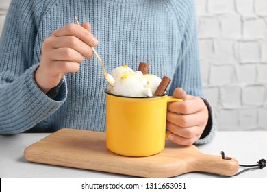 Woman Eating Snow Ice Cream At Table, Closeup