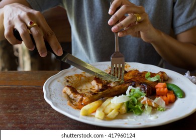 woman eating steak in a restaurant