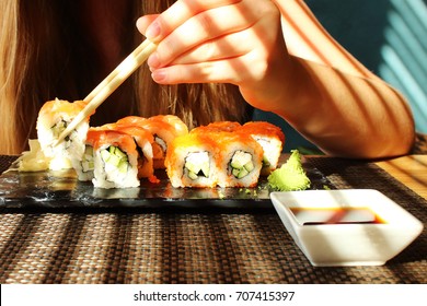 Woman Is Eating Sushi