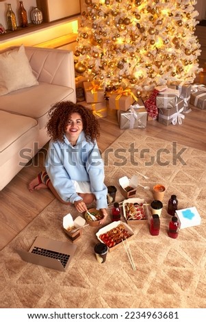 woman eating sushi, asian food restaurant, romantic evening, eating sushi with chopsticks, sushi delivery and takeout, eating at home, romantic dinner alone in christmas decor. Eve New year, saving