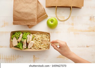 Woman eating tasty lunch ordered from food delivery service