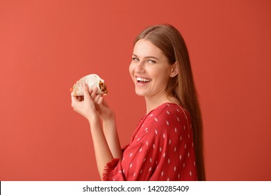 Woman Eating Tasty Taco On Color Background