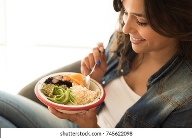 Woman Eating A Vegan Bowl Of Superfoods