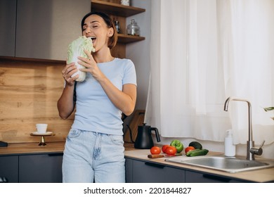 Woman Eats Salat At The Kitchen