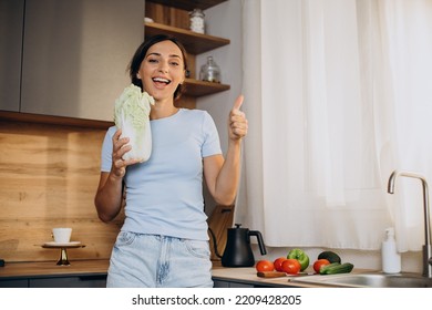 Woman Eats Salat At The Kitchen