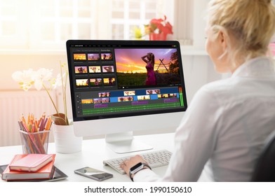 Woman Editing Video On Desktop Computer