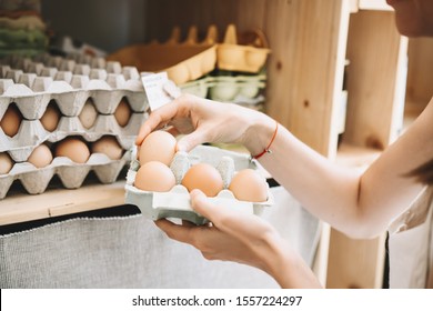 Woman With Egg Carton Box Buying Bio Organic Eggs From Local Farm In Zero Waste Shop. Shopping In Sustainable Plastic Free Grocery Store. Minimalist Lifestyle