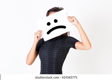 Woman in elegant dress holding dissatisfied face paper - unhappy and dissatisfied treatment concept