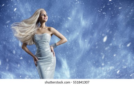 Woman Elegant Fashion Dress, Long Hair Waving On Wind, Beauty Model Posing Over Blue Winter Background