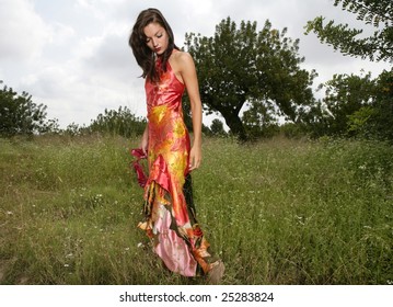 Woman Elegant, With Red Dress Haute Couture, On The Forest Outdoors