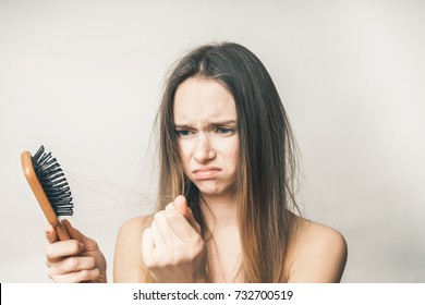 Woman With Emaciated Lost Hairs On Comb