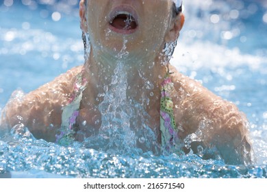 Woman Emerging From Swimming Pool