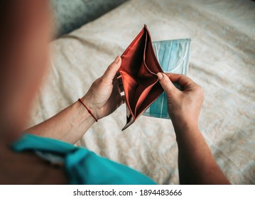 Woman With An Empty Wallet In Her Hands. Context Of Lack Of Money Due To Coronavirus. The Woman Opened The Wallet, And It Is Empty