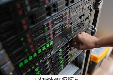 Woman It Engeneer Work In Modern Interior Of Server Room In Datacenter.