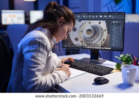 Woman engineer architect working in modern cad program sitting at desk in start-up business office. Industrial employee start new prototype idea on computer using inovative design concept