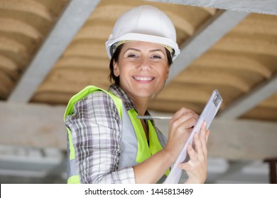 woman engineer and construction worker