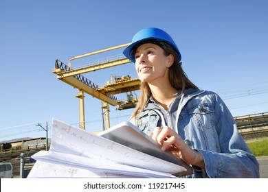 Woman Engineer On Building Site Using Tablet