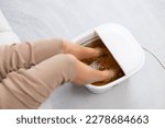 Woman enjoy footbath at home