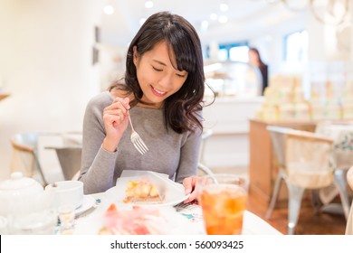 Woman Enjoy Her Slice Of Cake