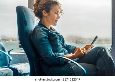 Woman enjoy travel leisure using mobile phone on board seats and having relax. Cruise ship boat seats and people traveling. Transort on sea concept. Casual female people on ocean transportation