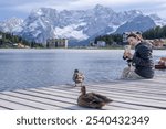 Woman enjoy view of Lago di Misurina - Misurina Lake winter season Dolomiti , Italy