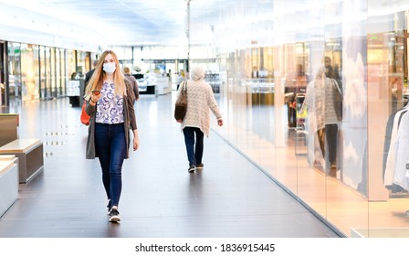 Woman Enjoying The Day In The Shopping Mall. With Face Mask. High Quality Photo