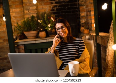 Woman Enjoying In Her Backyard. Night Scene