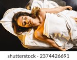 Woman enjoying massage in massage parlor.Health concept