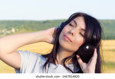Woman enjoying music in headphones - Shutterstock ID 1467814820