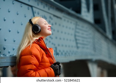 Woman Enjoying Music On Headphones
