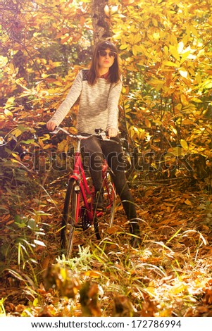 Image, Stock Photo Woman with a bike in the middle of the forest.