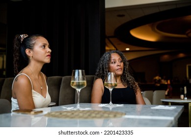 Woman Enjoying A Night Out Downtown At A Hotel Bar Engaging In Conversations 