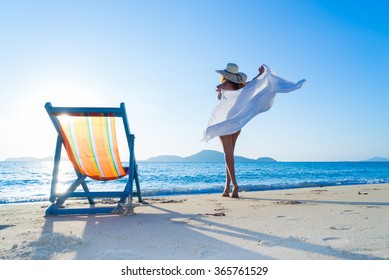 Woman enjoying the sun at the tropical beach
